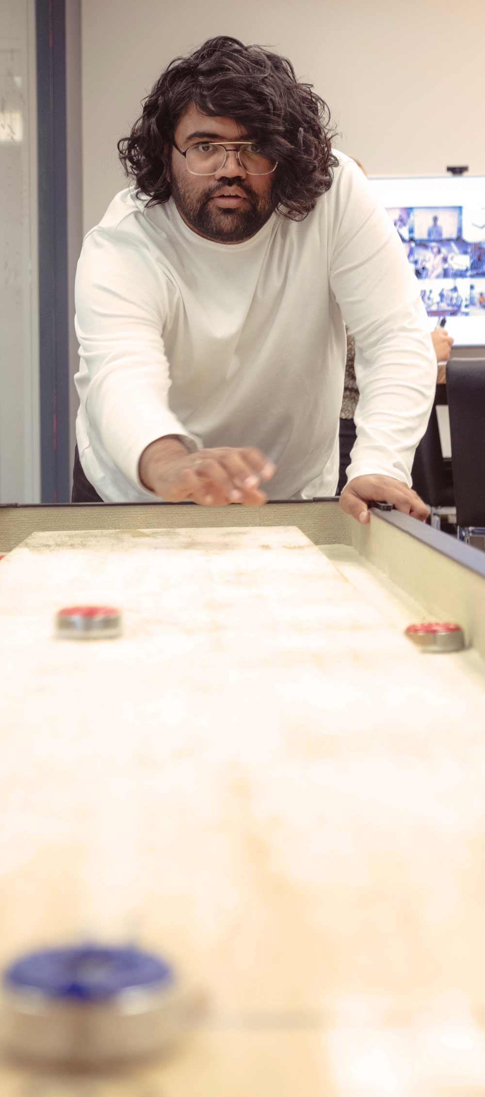 Karan playing shuffleboard